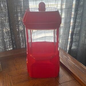 Red and clear glass popcorn carrier shaped canister